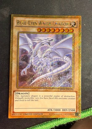 Blue-Eyes White Dragon (Gold Secret Rare), graded 9.0