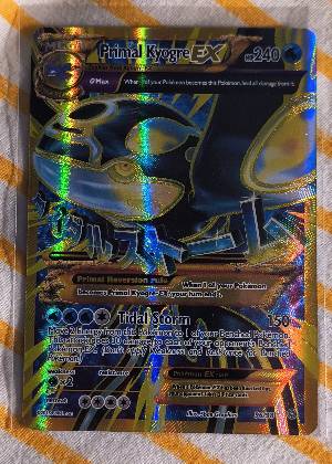 Primal Kyogre EX, graded 7.5