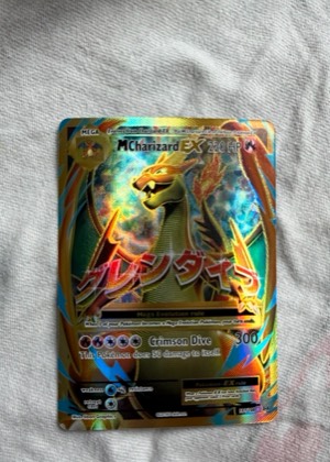 M Charizard EX (Full Art) graded 8.5