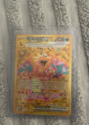 Charizard ex, graded 8.5