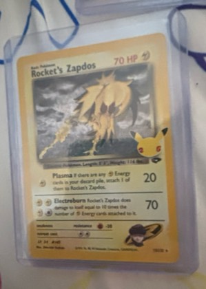 Team Rocket's Zapdos (EB Games Exclusive), graded 8.0