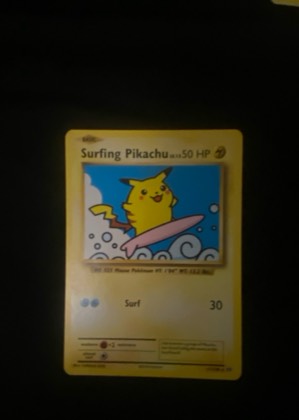 Surfing Pikachu, graded 7.5