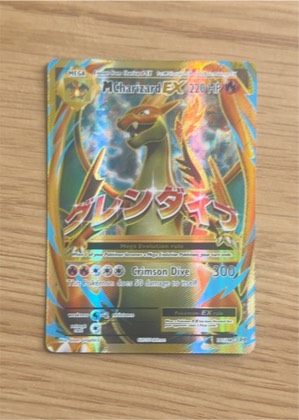 M Charizard EX (Full Art), graded 9.0
