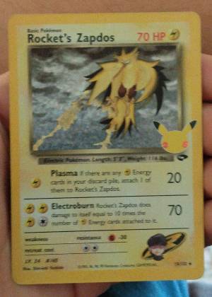Rocket's Zapdos graded 8
