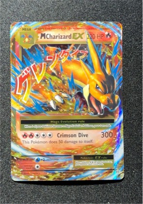M Charizard EX graded 7