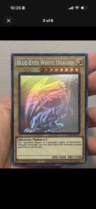 Blue-Eyes White Dragon (Ghost Rare), graded 9.0
