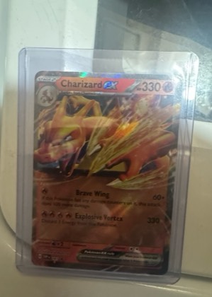 Charizard ex, graded 7.5