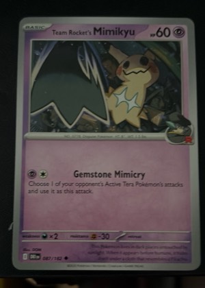Team Rocket's Mimikyu graded 8