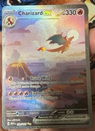Charizard ex, graded 9.0