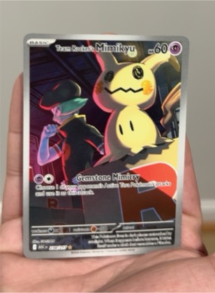 Team Rocket's Mimikyu graded 6 & below