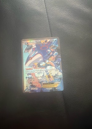 Team Aqua's Kyogre EX graded 8