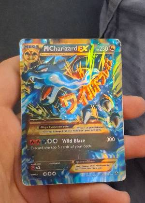 M Charizard EX, graded 4.5