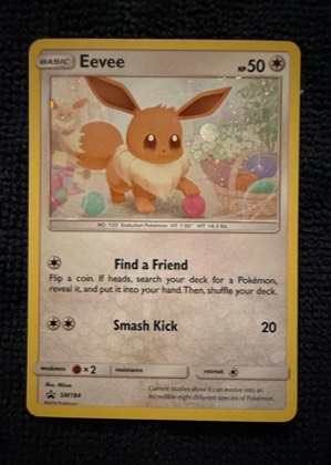 Eevee - SM184 (Cosmos Holo), graded 8.5