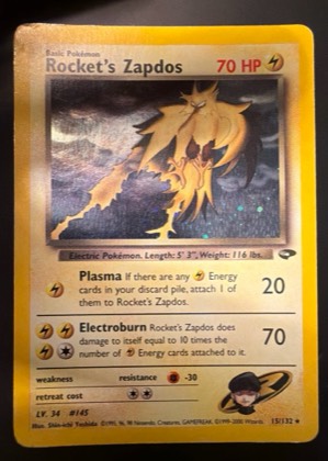 Rocket's Zapdos graded 7