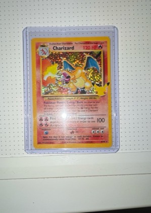 Charizard (Celebrations Metal Card), graded 5.5