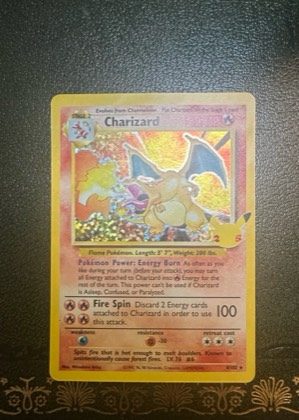Charizard (Celebrations Metal Card), graded 7.5