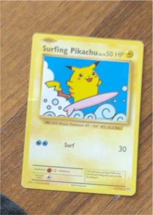 Surfing Pikachu graded 7