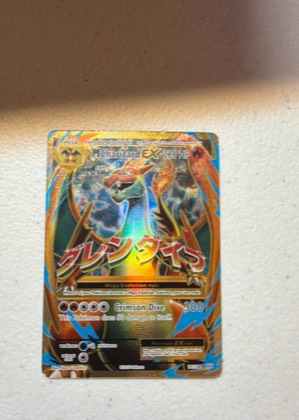 M Charizard EX (Full Art), graded 9.0