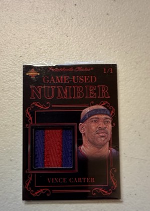 Vince Carter President's Choice 2019-20 Solitaire Series Game-Used Number Relic, graded 6.5
