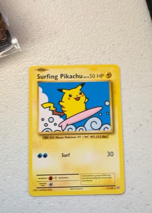 Surfing Pikachu, graded 6.5
