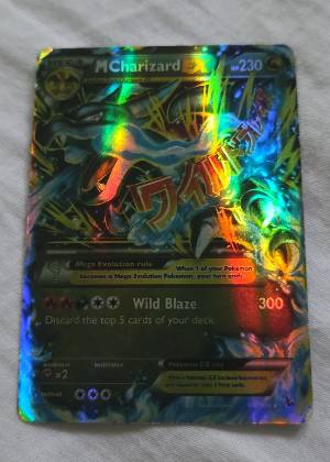 M Charizard EX (X) graded 6 & below