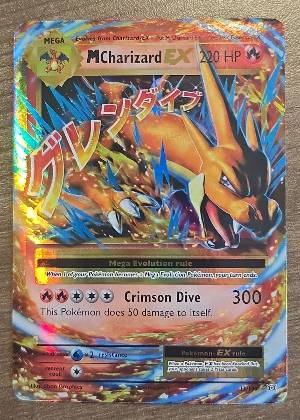 M Charizard EX, graded 9.0