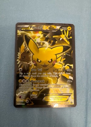 Pikachu EX - XY124 graded 8.5