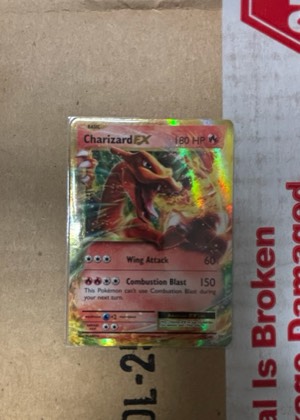 Charizard EX, graded 8.5