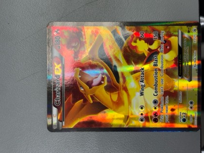 Charizard EX, graded 8.0