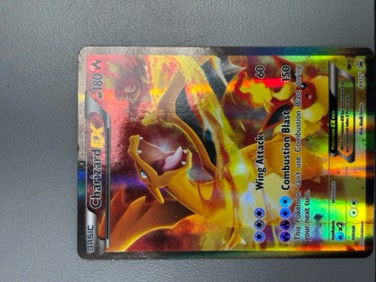 Charizard EX, graded 5.5