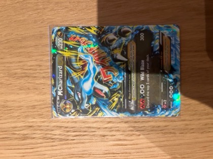 M Charizard EX (X), graded 8.0