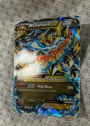 M Charizard EX (X), graded 2.5
