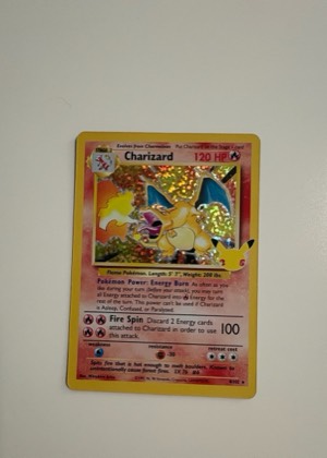 Charizard (Celebrations Metal Card), graded 8.0