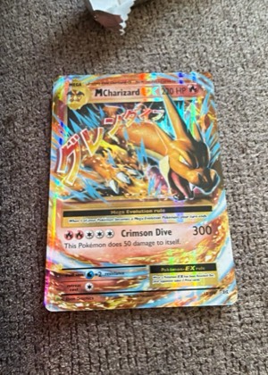 M Charizard EX graded 6 & below