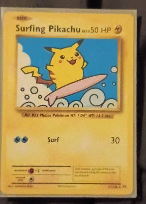 Surfing Pikachu, graded 7.5