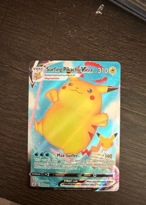 Surfing Pikachu VMAX, graded 8.5