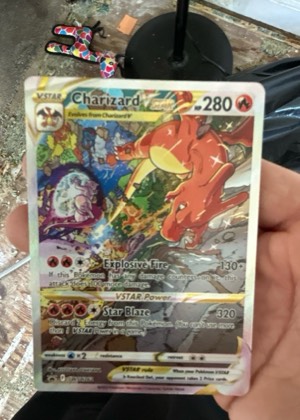 Charizard V (Alternate Full Art) graded 6 & below