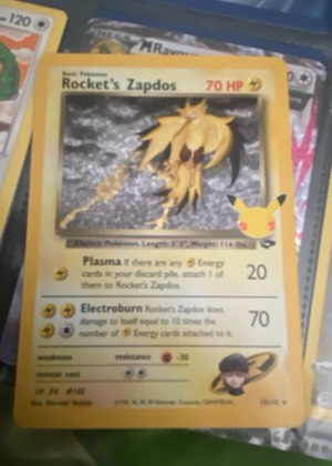 Rocket's Zapdos, graded 8.0