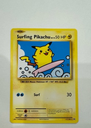 Surfing Pikachu graded 6 & below